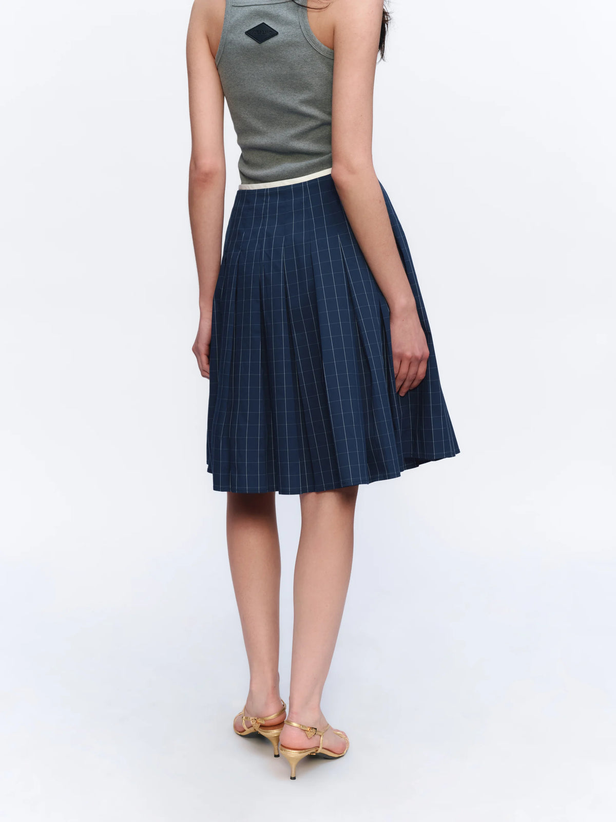Asymmetric Checked Pleated Mini Skirt - model photograph 4